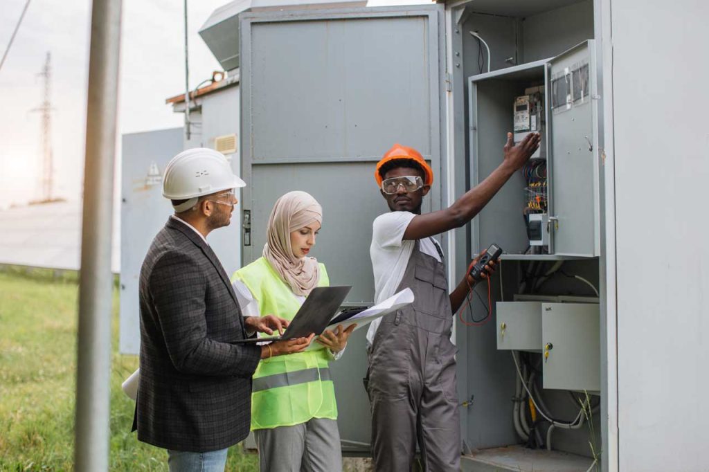 A homeowner discussing electrical needs with an electric technician