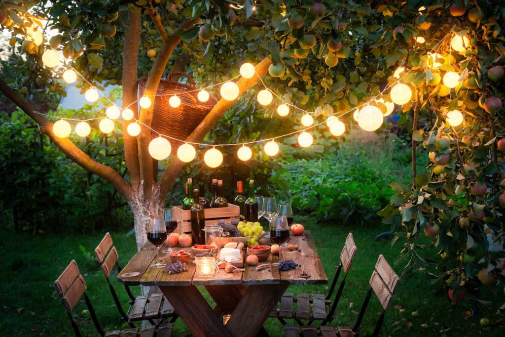 An outdoor patio area is adorned with string lights, which enhance the ambiance and create a welcoming atmosphere.